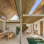 Open-plan living room with high ceilings and garden views