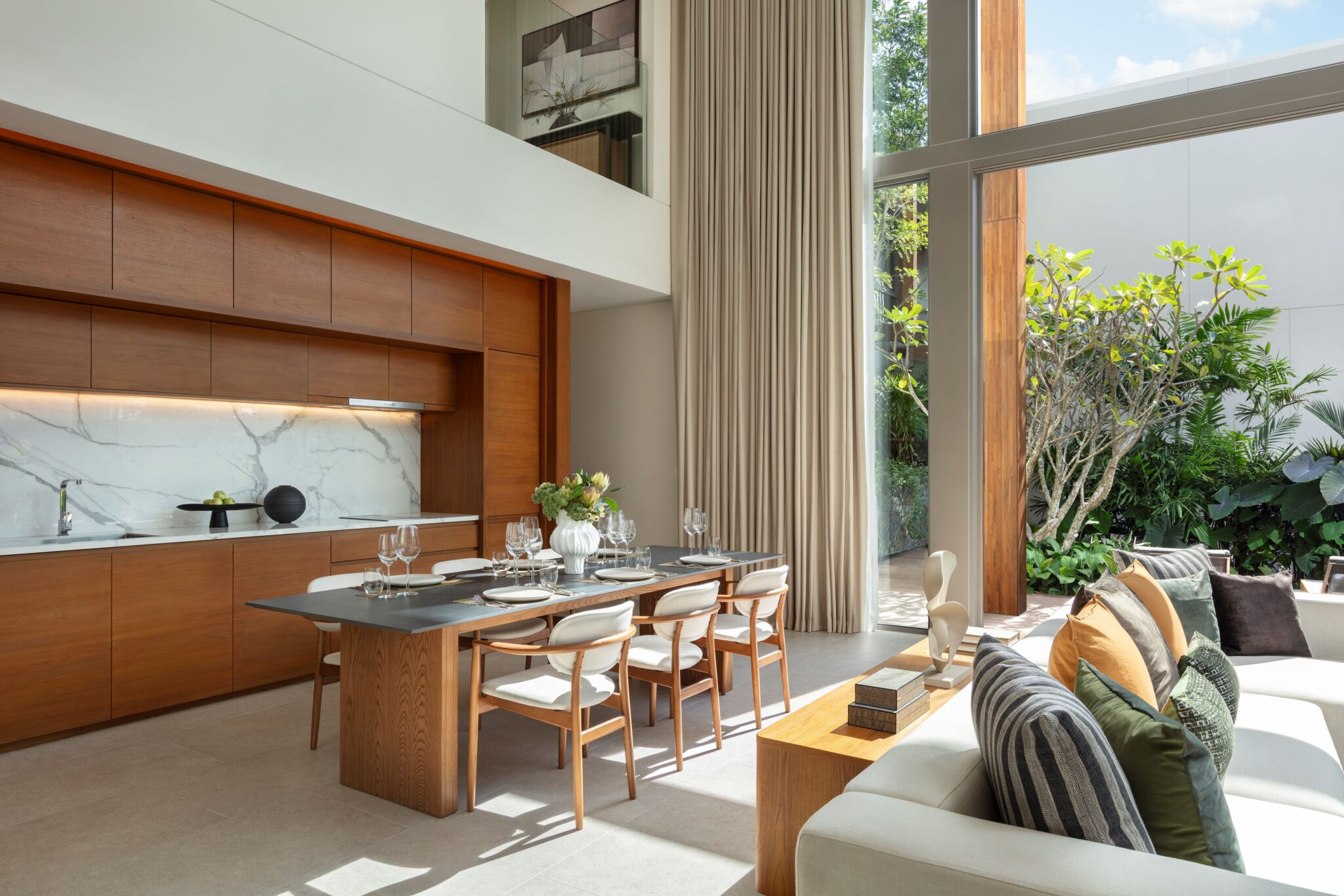Living and dining area of a branded residence villa in Phuket.
