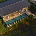 Aerial view of lakefront villa plots within a preserved forest estate