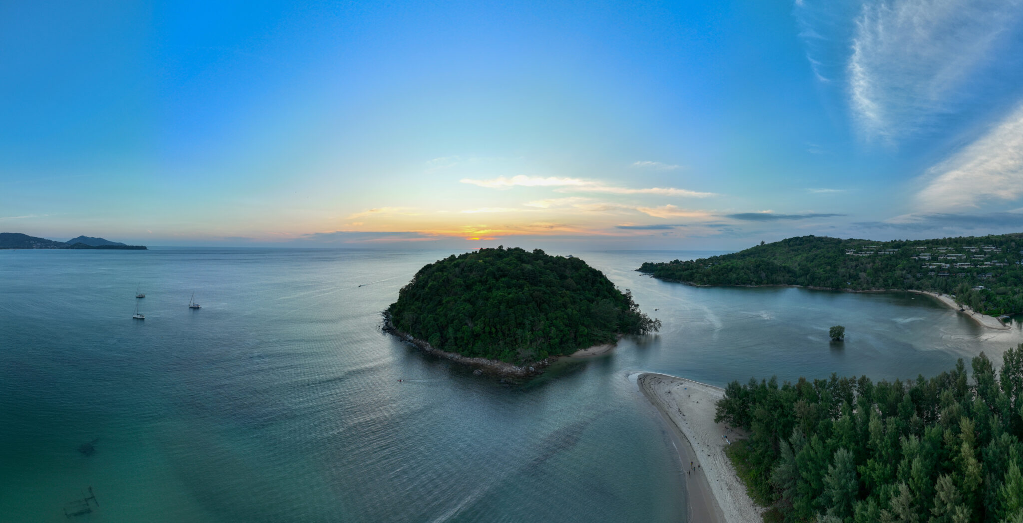 aerial view beautiful sunset above Kala island at Layan beach Phuket. colorful sky of sunset at horizon.Phuket beach sea Amazing beach, Beautiful beach Phuket Thailand, Nature and travel concept.