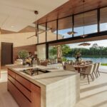 Kitchen island and fitted cabinetry open to the lake view, Cherng Talay