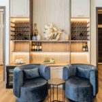 Wine wall and lounge chairs off the dining room